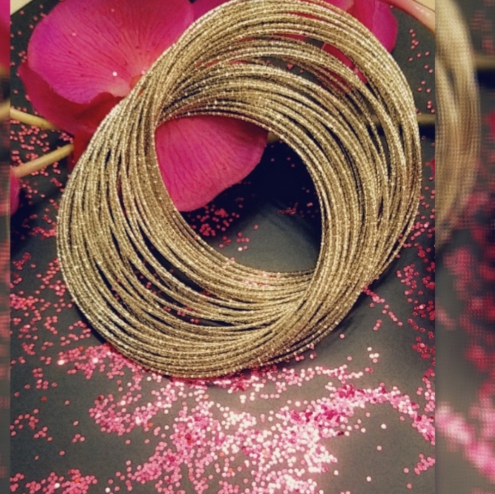 Multiple Silver Bracelet Wrapped Up In One.